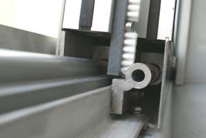 Protective door adjustment in a car wash